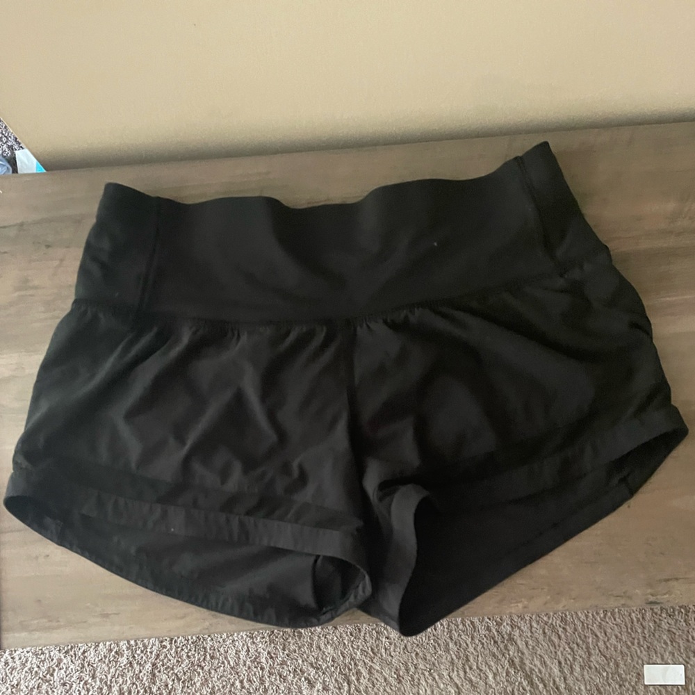 Lululemon black shorts with mesh strip on front